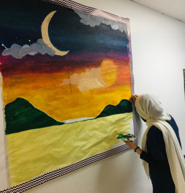 female muslim doing paint